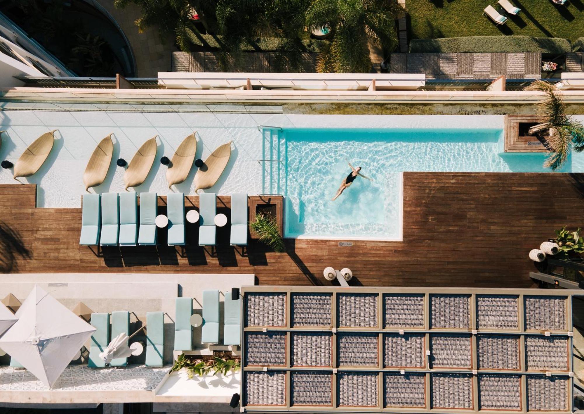 Aguas de Ibiza Grand Luxe Hotel Santa Eulalia del Río Exterior foto The rooftop pool at the hotel